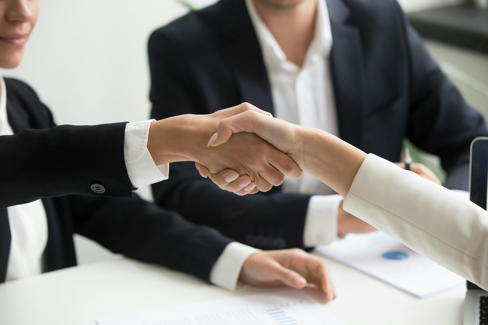 Two people in a sales meeting reviewing a pipeline